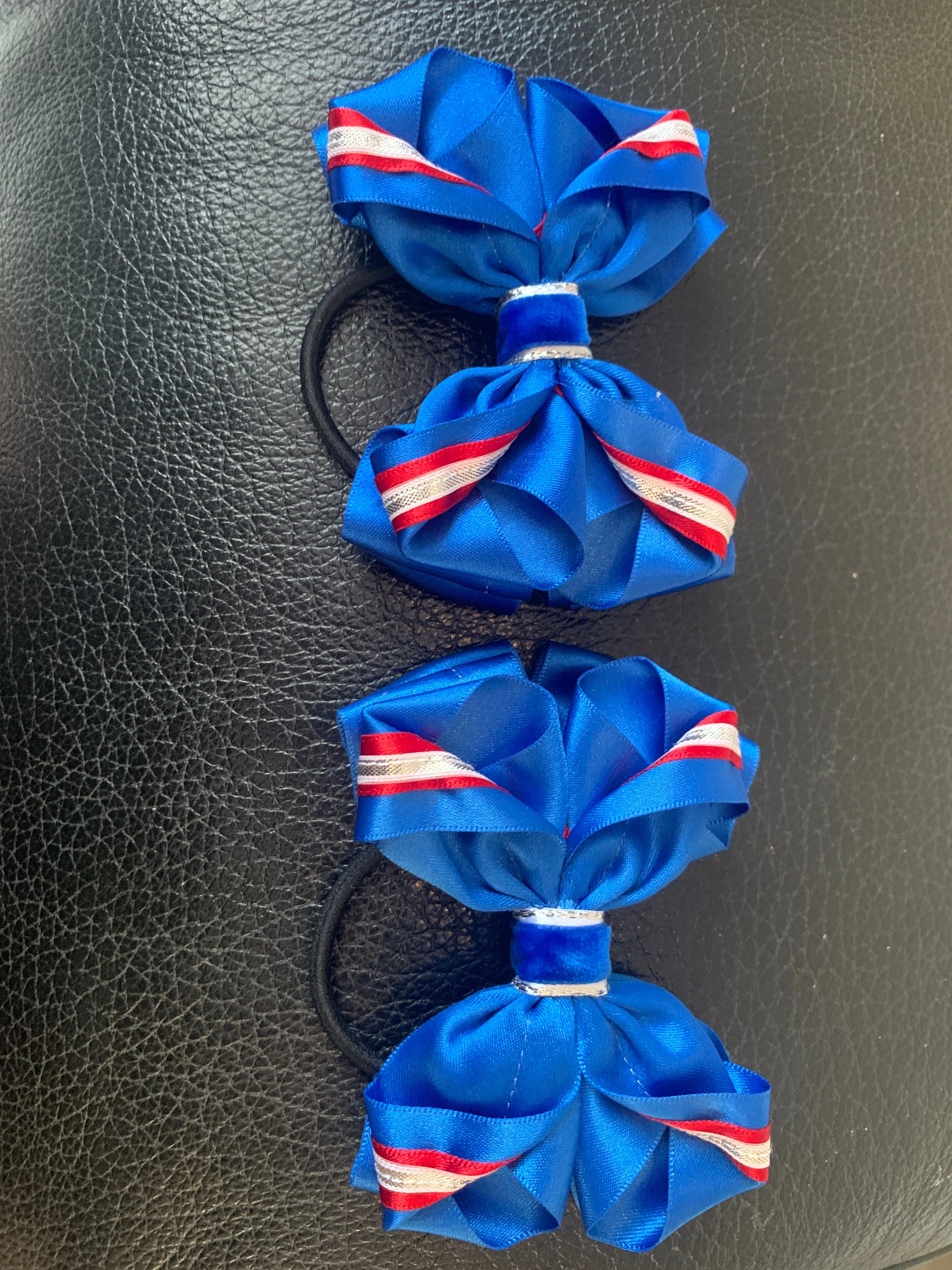 Luxury Bows: Royal blue and red twist bows